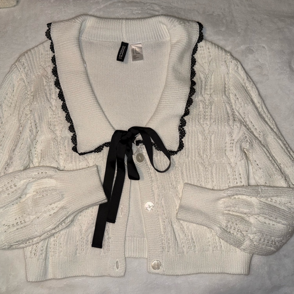 Chic Off White Cardigan with Black Trim